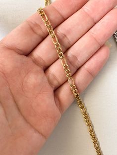 Dainty flat Figaro chain link necklace ❀❀ INFO: ❀❀ ➳ Adjustable lobster clasp closure ➳ Optional extender chain ➳ Material is stainless steel ➳ Chain width: 4mm This chain is also available as a bracelet: https://www.etsy.com/listing/575618158/gold-figaro-chain-bracelet-flat-curb?ga_search_query=figaro&ref=shop_items_search_1 ❀❀ SHIPPING & PROCESSING: ❀❀ Please refer to my shop announcements (located on home page) for the latest processing times as they may change All products are MADE T Stainless Steel Figaro Chain Necklace, Figaro Chain Necklace, Figaro Chains, Figaro Chain, Choker Necklaces, May 7, Chain Link Necklace, Link Necklace, Steel Chain