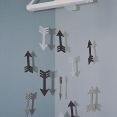 there are many arrows hanging on the wall