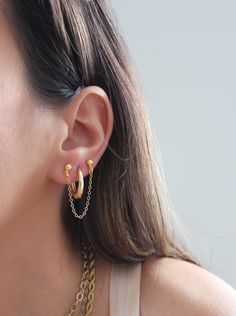 These dainty gold chain earrings are a dream for our multiple piercing girls out there. They’re the perfect way to bring out the glamour in your everyday styling. Crafted in 14k gold filled, these gorgeous earrings have a petite design that can be worn with any outfit or occasion. Perfect for any stylish fashionista, these gold chain earrings are the definition of glamorous. MATERIALS & SIZE Material: 14k gold filled chain, 18k gold plated studs Size: 2 in. JEWELRY CARE Most of our jewelry is ta