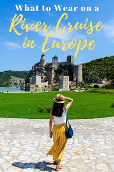 a woman standing in front of a castle with the words what to wear on a river cruise in europe