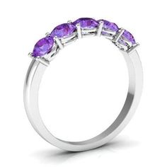 The February birthstone, amethyst, is said to give the wearer a sense of calm and balance. The five gemstones chosen for this ring are round brilliant cut and weighing approximately 1.00 cttw. We only use genuine gemstones that are AAA quality. White, yellow, or rose gold (14 or 18 kt) are available as well as platinum for the 4mm setting, which will be made in the finger size selected. Product Information Metal: Gold or Platinum Setting: Shared Prong Width: Approx. 4.0 mm Gemstone Information Carat Weight: 1.00cttw Quality: AAA Shape: Round No. of Stones: 5 Diamond Birthstone Ring, Amethyst Wedding Rings, Classic Solitaire Ring, St Valentine, Amethyst Set, Amethyst And Diamond Ring, Diamond Birthstone, February Birthstone, February Birth Stone