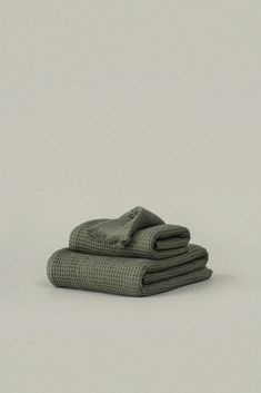 two folded towels sitting on top of each other