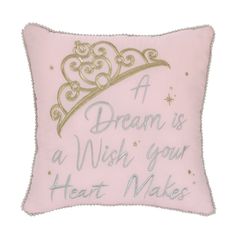 a pink pillow with a tiara on it that says, a dream is a wish your heart makes