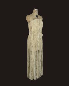 fitted long dress, V cut and defined waist. Base made from canva stretch covered with french fabric designed with fringes.Vestido largo de corte entallado con cintura definida y escote en V. Elaborado en base de canva recubierto con tejido francés diseñado con flecos a modo de hilachas. Elegant Fitted Maxi Dress With Tassels, Fitted Maxi Dress With Tassels For Evening, Fitted Floor-length Dress With Tassels, Floor-length Dresses With Tassels For Gala, Floor-length Gala Dresses With Tassels, Elegant Floor-length Maxi Dress With Tassels, Evening Fringe Maxi Dress, Evening Fringed Floor-length Maxi Dress, Evening Fringe Floor-length Maxi Dress