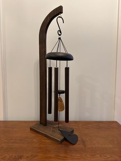 an old wind chime on a wooden table