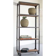 a book shelf with two vases on top of it and books in the bottom