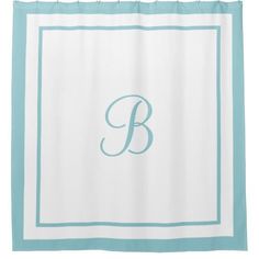 a blue and white monogrammed shower curtain with the letter b on it