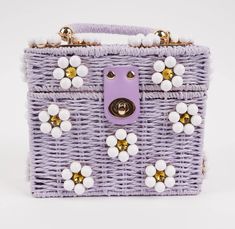 Beaded woven rattan daisy flower purse with wooden top handle. Perfect bucket bag for any occasion from tropical vacations to Saturday brunch with friends. Room for all your daily necessities & available in various eye-catching colors! Purse dimensions: 6.29"(16cm) x 3.34"(8.5cm) x 7.5" (19cm) Custom Interior Lining. Includes gold shoulder chain. Jenna Lee, Daisy Bags, Sunny Vacation, Wicker Box, Tropical Vacations, Brunch With Friends, White Daisies, Woven Rattan, Shoulder Chain