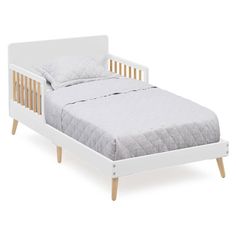 a small white bed with wooden slats on the headboard and foot board, in front of a white background