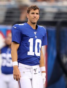 a close up of a football player wearing a uniform