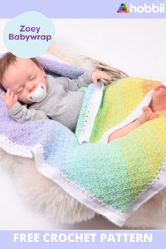 a baby sleeping in a crochet rainbow blanket