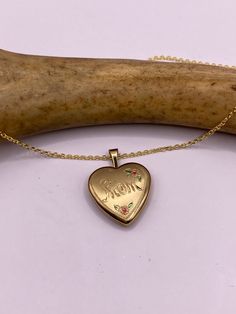 "Vintage tiny mini heart locket  9k Gold filled Engraved with \"Mom\" This tiny treasure has about a half inch photo space, just the locket without the bale.  Vintage 1960's one of a kind.  Does not tarnish or change color.  on a gold 925 chain 16, 18, 20 or 24 inch  Lovely etched design Can hold tiny sized photo. Laminate photo before inserting for longevity  Ships on a gold 925 sterling silver chain  Thank you for supporting a small veteran owned business! All jewelry is shipped free within th Mother's Day Heart Charm Locket Necklace Gift For Mom, Gold Locket Necklace With Hallmark For Mother's Day, Gold Locket Necklace For Mother's Day With Hallmark, Vintage Personalized Jewelry For Mom, Gold Locket Necklace For Mother's Day, Mother's Day Locket Necklace With Charms, Antique Engraved Jewelry For Mother's Day, Gold Engraved Locket Necklace For Mom, Engraved Gold Locket Necklace For Mom