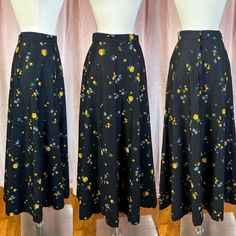 "1970s Black Floral Cotton Maxi Skirt 26\" Waist  Pretty yellow, blue and green floral print Zips up the back Belt loops on each side of the hips Waist: 26\" Hips: 44\" Length: 31.5\" Zipper: 7\" Labels/Materials: 100% Cotton - century of Boston Excellent condition, just has a few light ish spots that may be able to lift with a stain remover, please see photos Some tiny snags" Vintage Flowy Skirt Bottoms With Floral Print, Retro Floral Print Skirt, Retro Long Skirt With Floral Print, Gold Beaded Dress, Pastel Top, Cotton Maxi Skirt, Green Floral Top, Beaded Formal Dress, Cotton Maxi Skirts