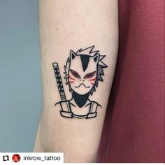 a person with a tattoo on their arm holding a knife and wearing an evil mask