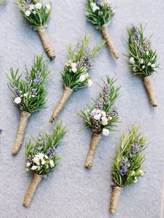 small bouquets of flowers are arranged on the ground