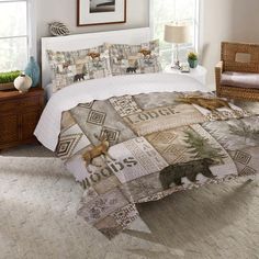 a bed in a bedroom with an animal theme on the comforter and pillow cases