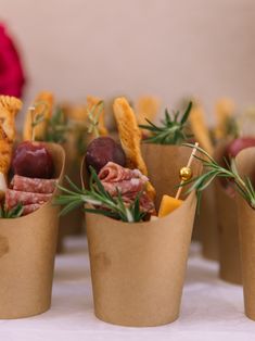 small cups filled with food sitting on top of a table