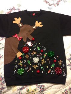 a black sweater with reindeer and christmas decorations on it