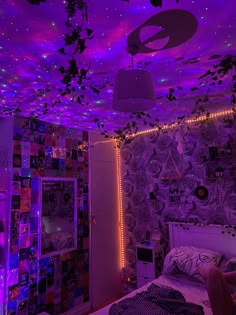 a bedroom with purple lights and decorations on the ceiling