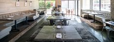 an empty restaurant with tables and chairs