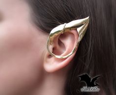 "Earrings - cuffs \"Elf\" in the shape of a sharp elf ear. They fit perfectly on the ear and are very lightweight. Possible materials of manufacture: \"Silver\" -  Nickel Silver (Jewelry alloy of silver color, does not contain silver. Other name: Maillechort, German silver.) \"Gold\" - Brass (Jewelry alloy of gold color) \"Sterling Silver\" - 925 Sterling Silver (This is a precious 925 alloy) All the jewelry in my shop is made by hand. With love and individually. This means that minor differences from the original are possible, but it also means that you receive a unique work of art. Term of manufacturing of the order of 2-4 weeks. I understand that this is a long time. But manual work requires a lot of time. Have patience and you will receive a unique handmade jewelry from the Studio Mani Handmade Elven Earrings For Gift, Fantasy Metal Ear Cuff For Gift, Fantasy Metal Ear Cuff For Pierced Ears, Handmade Gold Jewelry For Cosplay, Elven Style Metal Jewelry Gift, Elven Style Metal Jewelry For Gifts, Handmade Fantasy Metal Cartilage Earrings, Handmade Metal Fantasy Cartilage Earrings, Fantasy Style Single Ear Cuff As Gift