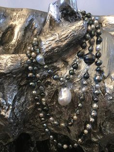 132 South Sea, Tahitian, and Akoya pearls are hand-knotted on silk. A rare “cake-pop” Baroque pearl hangs central to this necklace. Can be worn long, doubled, or three times around the neck. No clasp. 66" with 1.5" drop. Elegant Hand-strung Lariat Necklace, Elegant Hand-strung Round Beads Long Necklace, Elegant Hand-strung Necklace With Round Beads, Elegant Long Necklace With Hand-strung Round Beads, Elegant Hand-knotted Lariat Necklaces, Elegant Lariat Necklaces Hand Knotted, Elegant Hand-knotted Silver Jewelry, Elegant Hand Knotted Silver Necklace, Elegant Hand Knotted Silver Jewelry