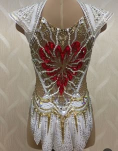 the back of a woman's body with red and white sequins on it