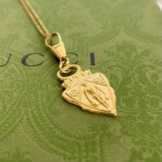 Vintage Gucci Gg Charm Pendant Necklace Authentic Vintage Gucci Charm Pendant 18” 18k Gold Plated Sterling Silver Necklace (Unbranded) Black Velvet Necklace Display Box (Unbranded) Color: Gold Pendant Size: Approximately 1” X 1.5” Chain Length: 18” Chain Width: 1.1mm Ships Same Or Next Day *This Is An “Upcycled” Item That May Have Minor Imperfections Including Light Fading And Wear. See Photos For Quality. Gold Medallion Necklace With Logo Charm, Classic Yellow Gold Necklace With Logo Charm, Yellow Gold Medallion Necklace With Logo Charm, Classic Necklace With Logo Charm For Gift, Classic Necklace With Logo Charm As Gift, Classic Logo Charm Necklace For Gifts, Gold Necklace With Logo Charm For Gift, Gold Necklace With Logo Charm As Gift, Yellow Gold Necklace With Logo Charm For Gifts