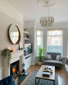 a living room filled with furniture and a fire place