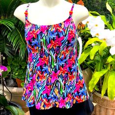 This Beautiful Floral Print Tankini Top Has A Built In Soft Cup Bra. It Fits B/C Cup. It Has Adjustable Straps With Orange And Pink Decorative Beads In Front. The Top Flares Out Under The Bust. It Is Made To Hide Your Tummy. See Photo’s Above For Measurements. The Length Was Taken With Straps At The Long Point. Fitted Multicolor Tops For Beach Season, Colorful Fitted Tops For Beach, Fitted Top With Vibrant Print For Vacation, Fitted Tops With Vibrant Print For Vacation, Fitted Multicolor Top For Vacation, Fitted Pink Top With Vibrant Print, Vibrant Fitted Blue Top, Vibrant Blue Fitted Top, Vibrant Fitted Beach Tops