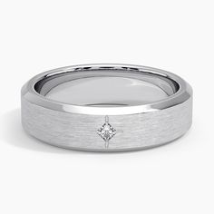 a wedding band with a diamond in the center