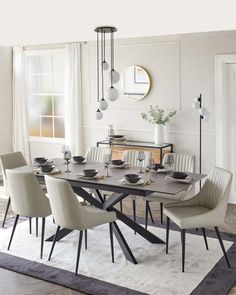 a dining room table with chairs around it