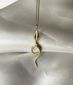 This snake pendant has the perfect size for everyday wear, with a length of approx 4 cm. It comes on a chain in either 40 or 45 cm length. The pendant and chain is crafted in either 24 ct gold plated sterling silver or 9 ct solid gold. Many off my pieces are in stock, however all pieces are handmade and could take up to 2-4 weeks for production and shipping. Please feel free to get in contact for inquires about the stock levels of specific items. If you need something for a specific date please let me know and I will do my best to accommodate you where possible. Gold Jewelry With Large Pendant On Snake Chain, Yellow Gold Brass Necklaces With Snake Chain, Yellow Gold Brass Snake Chain Necklaces, Gold Snake-shaped 14k Gold Necklace, Minimalist Snake Shape Chain Necklace For Gift, Gold Plated Snake Necklace, Gold Snake Shape 14k Gold Necklace, Brass Snake-shaped Necklace For Gifts, Tarnish Resistant Snake Shape Necklace As A Gift