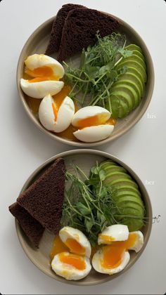 two plates with eggs, bread and avocado on them next to each other