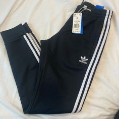 Brand New Adidas Joggers. Slim Fit, Tapered Bottoms. Adidas Black Bottoms With Side Stripes, Fitted Black Joggers For Spring, Adidas Black Joggers With Side Stripes, Adidas Black Joggers With Three Stripes, Adidas Black Sweatpants With Three Stripes, Adidas Black Three Stripes Joggers, Adidas Casual Black Bottoms, Black Joggers With Three Stripes, Black Adidas Cotton Sweatpants