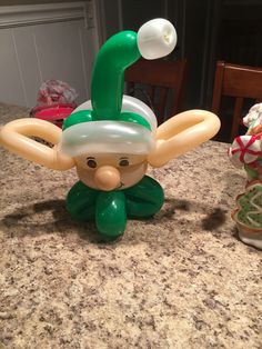 an inflatable balloon sitting on top of a counter next to a potted plant