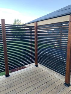 a wooden deck with black slats on it