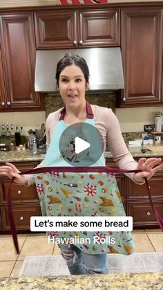 a woman standing in a kitchen holding an apron over her face with the words let's make some bread hawaiian rolls on it