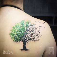 a woman with a tree tattoo on her back