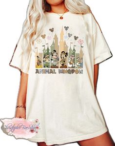 Disney Summer Shirt With Letter Print, Short Sleeve Shirt With Character Print For Disney Trips, Disney Trips Character Print Short Sleeve Shirt, Disney T-shirt For Fan Events In Spring, Character Print Graphic Tee For Disney Trips, Crew Neck Cotton Tops For Theme Park, Cotton Crew Neck Top For Theme Park, Disney Trips Graphic Tee With Character Print, Cotton T-shirt With Graphic Print For Theme Park