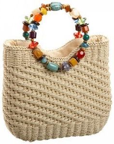 a straw bag with colorful beads on it