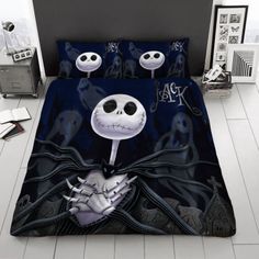 the bed is decorated in black and white with jack skellingy faces on it