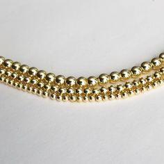 "One of our best Sellers Dainty 14K gold filled beaded ball necklace - dainty and minimalist in design, making it perfect for layering. Comes with 3\" extension option, you can wear it as choker or necklace, whichever style suits for the occasion! Our best sellers! Dainty and beautiful gold filled beaded necklace. With 3\" extension option, you can wear it as choker or necklace, whichever style suits for the occasion! Perfect standalone piece or great addition to your necklace layering, you can' Gold Beaded Necklaces With Spacer Beads For Gift, Gold Beaded Necklace With Spacer Beads As Gift, Dainty Gold Beads With Beaded Chain, Dainty Gold Beaded Necklaces, Dainty Gold Beaded Chain, Dainty Beaded Bracelets With Ball Chain, Dainty Beaded Necklaces With Gold Beads, Dainty Gold Beads For Jewelry Making, Dainty Polished Beaded Necklaces