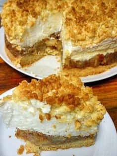 two white plates topped with pies on top of a wooden table next to each other