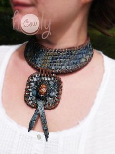 This beautiful handmade leather necklace is made from the finest quality blue snake print leather. It has beautiful sea shell incorporated into it's design. This medieval necklace is adjustable at the back so it fits all sizes. Handmade Leather Choker Necklace, Blue Leather Jewelry For Festivals, Artisan Blue Leather Jewelry, Handmade Leather Festival Necklaces, Handmade Leather Necklaces For Festivals, Handmade Leather Necklace For Festivals, Handmade Bohemian Snake Necklace, Handmade Leather Necklaces, Medieval Necklace