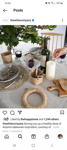 the table is set with wine and bread