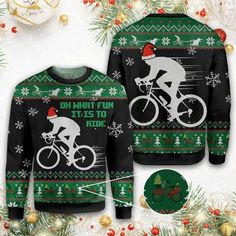 a sweater with an image of a man on a bike wearing a santa claus hat