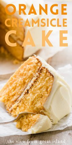 an orange cake with white frosting and a fork