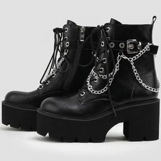 Description:Step into a rock-punk style and comfort this season with the exaggerated platform booties. Made of PU leather and thermoplastic rubber, embellished with metallic detailing embodied with an adjustable buckle closure and layered chains, featuring a round closed toe framed by a faux leather upper, a lightly cushioned footbed anchored by a shock-absorbing ridged outsole, an ankle-length shaft dotted with a lace-up fastening and silver-tone eyestays, a chic platform structured with a rubber block heel. Find more trendy women's platform boots and unique shoes in our boutique, and pair the lace-up boots well with a slashed mini dress and a cropped cardigan for a stylish street look - Heel height: 8cm. Size Length(in) Length(cm) 35 8.86 22.5 36 9.06 23 37 9.25 23.5 38 9.45 24 39 9.65 2 Punk Style Platform Boots With Round Toe For Concerts, Grunge Style Ankle-high Platform Boots For Winter, Punk Style Martin Boots With Chunky Platform For Fall, Winter Platform Martin Boots For Concerts, Winter Concert Platform Martin Boots, Platform Martin Boots With Round Toe For Concerts, Gothic Black Platform Martin Boots, Punk Style Faux Leather Ankle Combat Boots, Punk Style Martin Boots With Platform