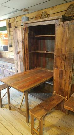 a wooden table and bench in a room